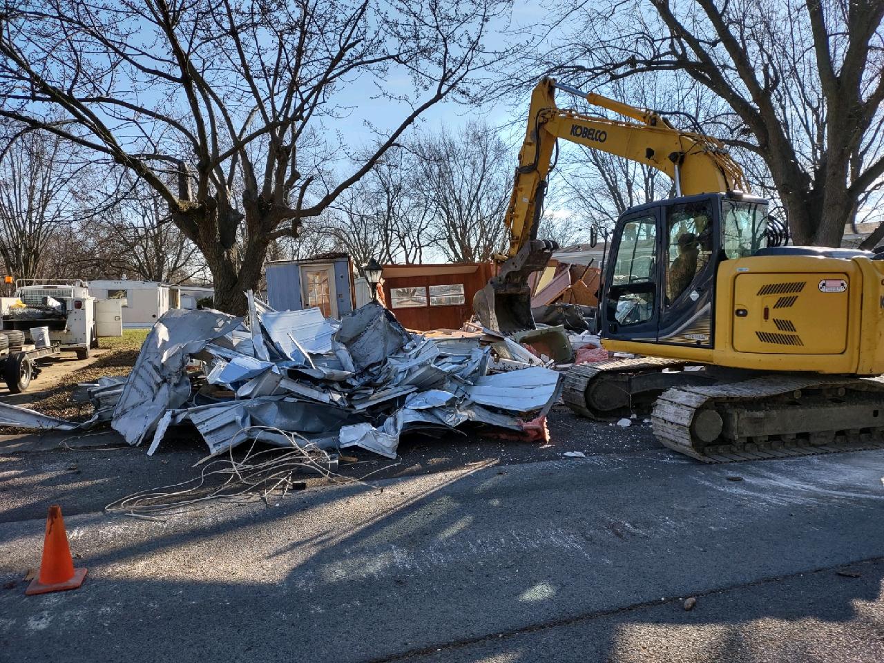 Hill Demolition crew and excavator clearing a demolition site